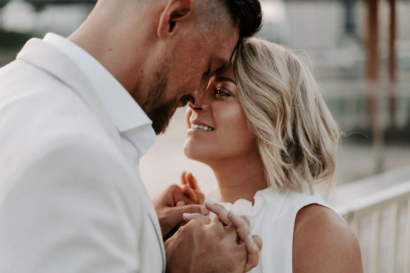 Shannon and Jacksen forehead to forehead by the river