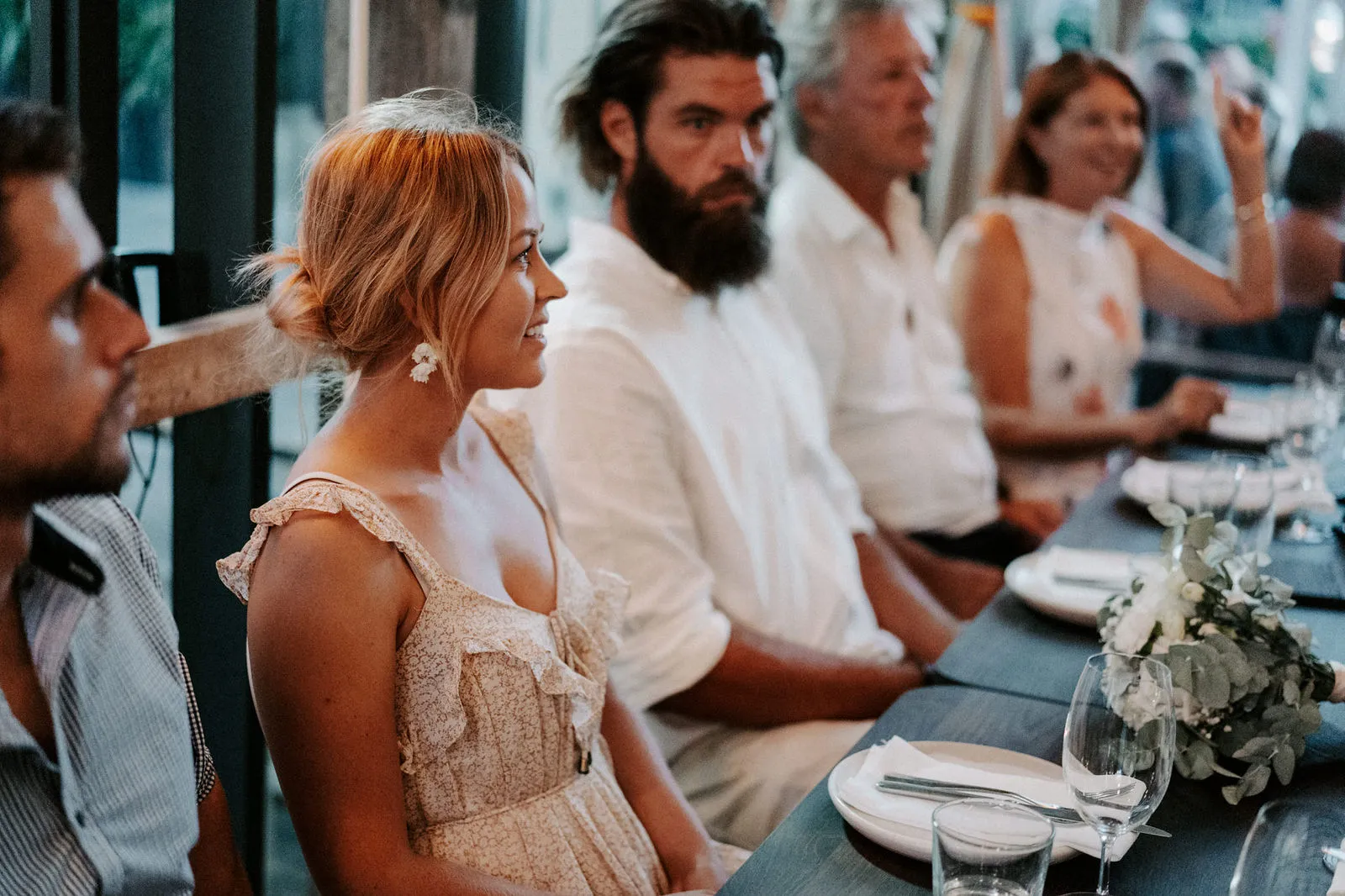 Guests talking and laughing along the reception table
