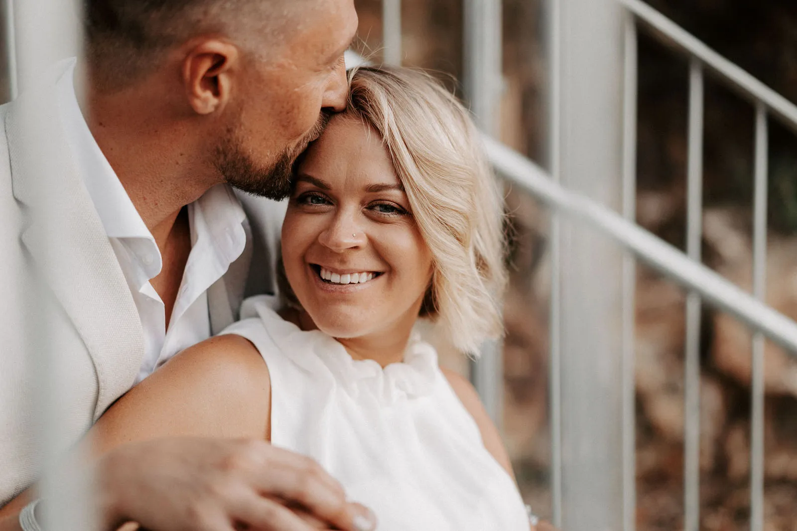 Jacksen kissing Shannon’s forehead as she smiles on the stairs
